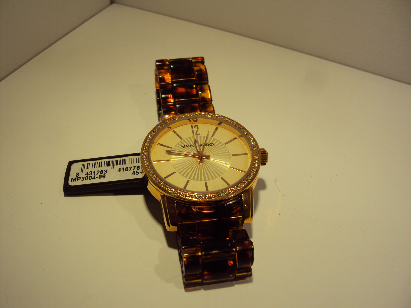 Reloj cobrizo con correa imitación a carey 45€